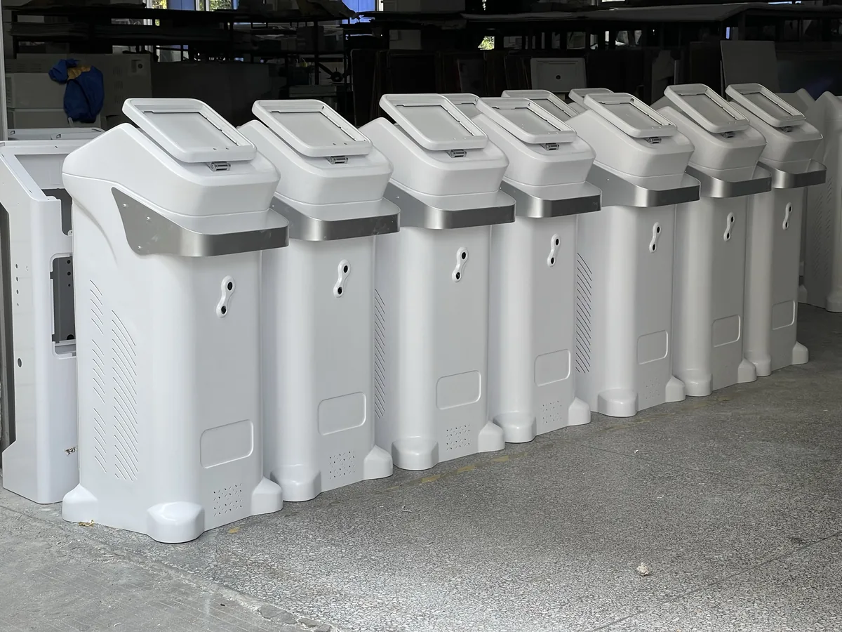 Unbranded beauty machine housings prepared in a FQBeauty factory work area