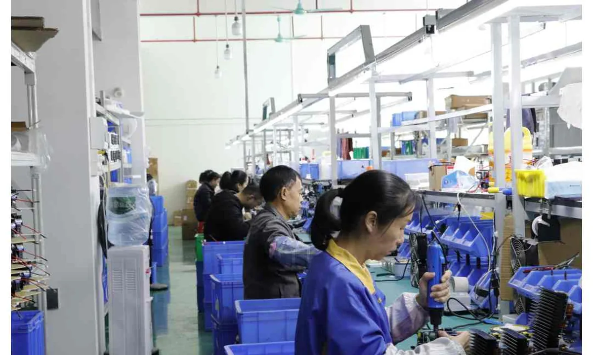 FQBeauty technicians assembling beauty equipment on the production line