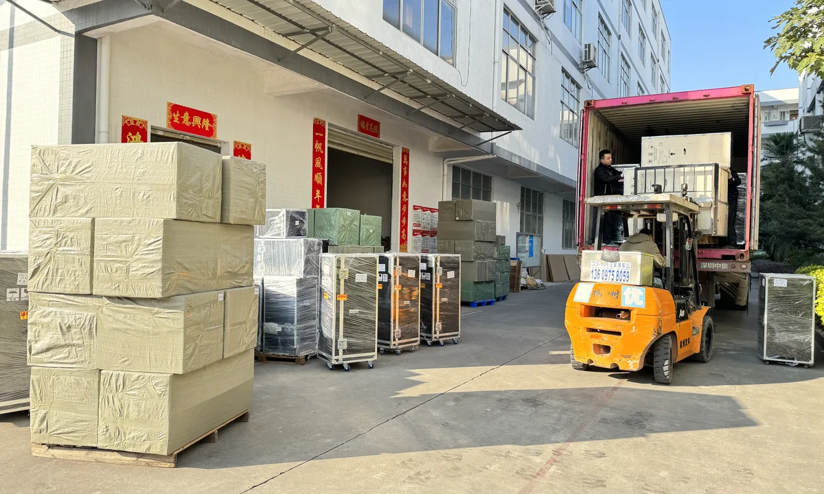 Beauty machines and protective cases being loaded for export shipment