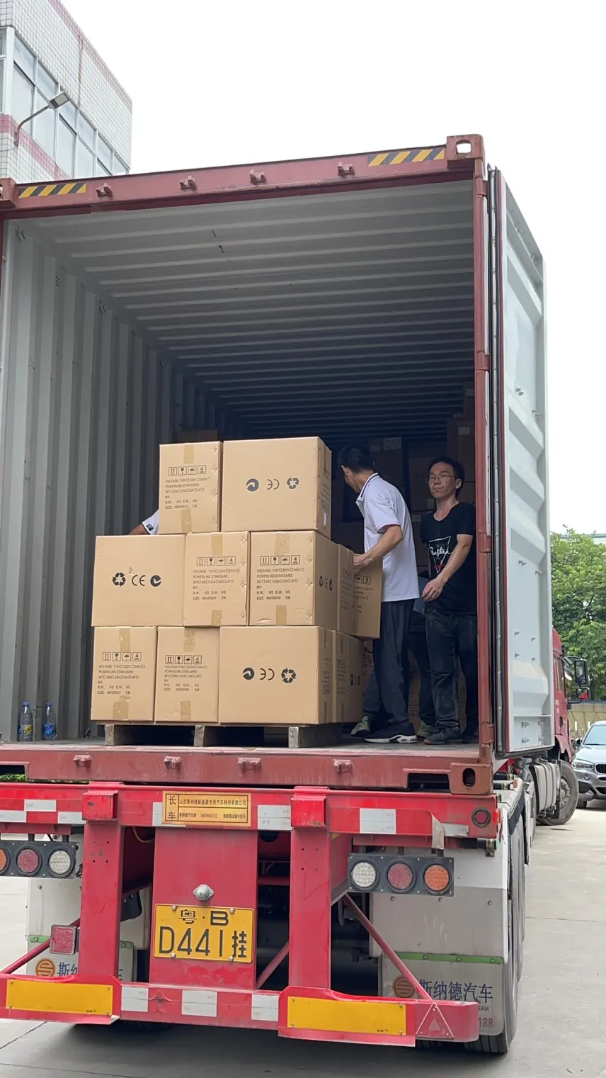 Packed beauty machine cartons being loaded into a container for international delivery