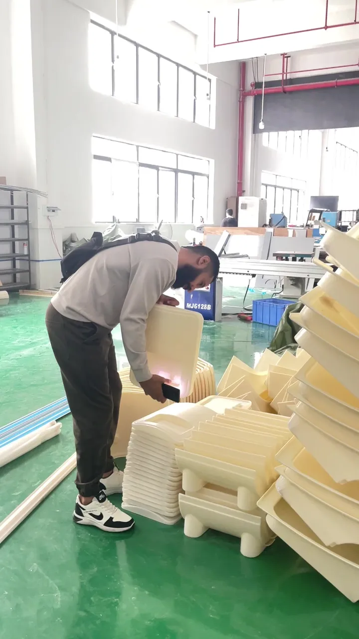 Overseas buyer checking beauty machine housings during OEM preparation